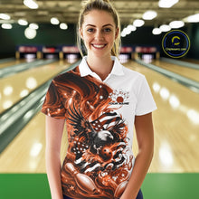 Load image into Gallery viewer, Front view female model at the bowling lane wearing a white and orange bowling polo shirt with eagle graphics and flag inspired accents.