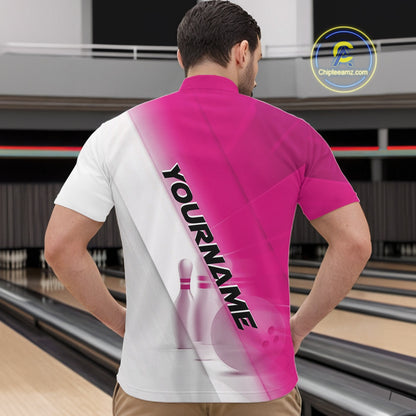 Male model front view at the bowling lane wearing a bowling quarter zip shirt with bowling ball and pins across a pink and white diagonal layout.