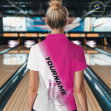 Load image into Gallery viewer, Female model back view at the bowling lane wearing a quarter zip shirt with bowling ball and pins across a pink and white diagonal layout.