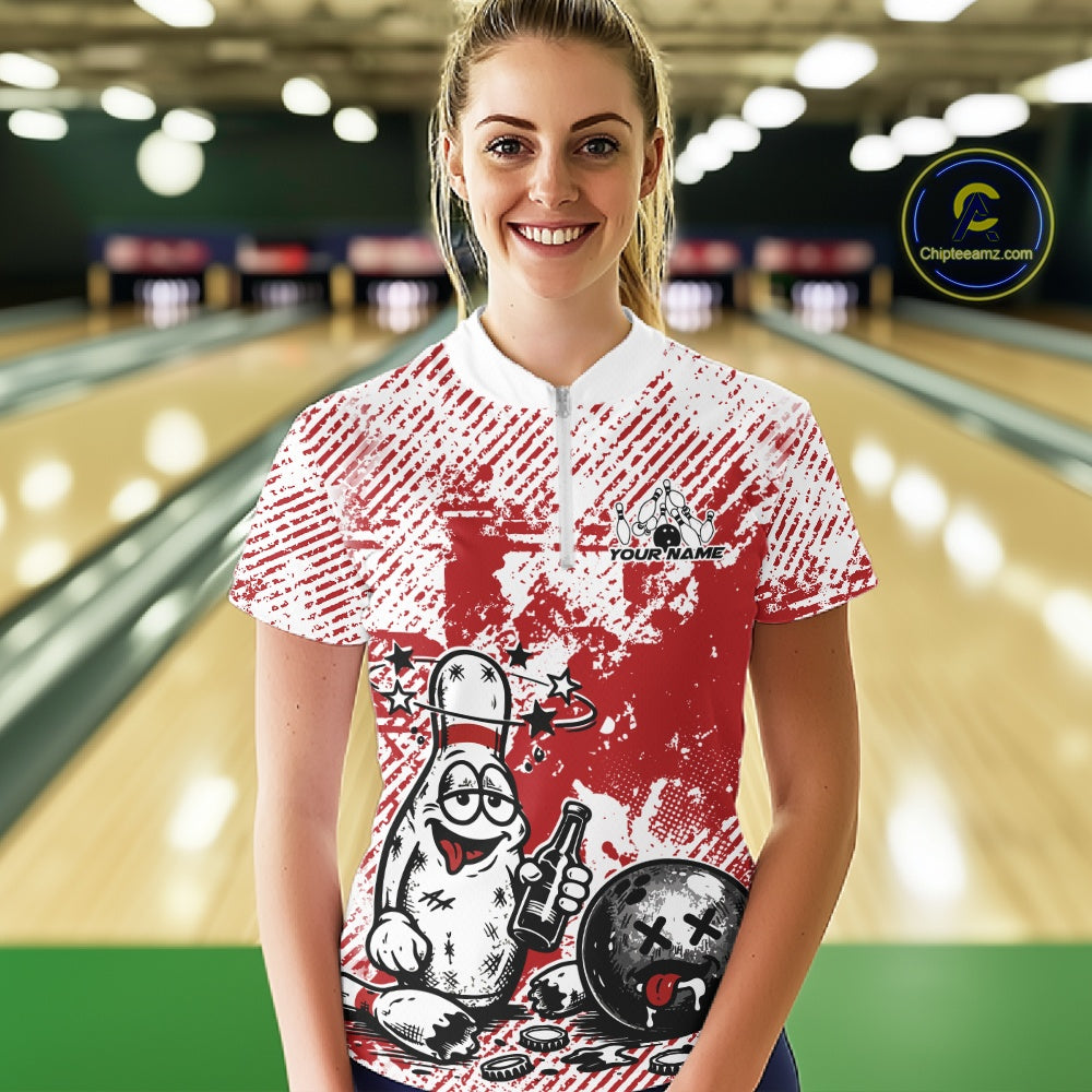 Front view female model wearing red and white bowling quarter zip shirt in bowling lane, cartoon bowling pin beer drinking design
