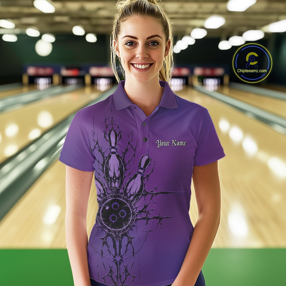 Woman wearing a purple bowling shirt with a design and text in a bowling alley.