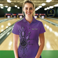 Load image into Gallery viewer, Woman wearing a purple bowling shirt with a design and text in a bowling alley.