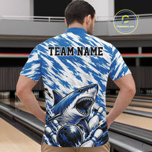 Load image into Gallery viewer, Person wearing a blue and white patterned shirt with a shark design and 'TEAM NAME' text on a bowling alley background.