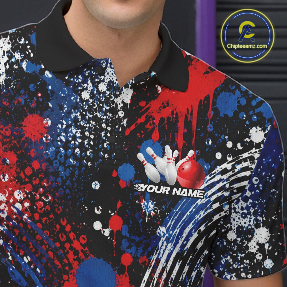 A man wearing a custom red, white, and blue paint splatter patriotic eagle bowling polo shirt with a personalized team name template inside a bowling alley.