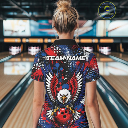 Female model showcasing the back design of a custom red, white, and blue patriotic eagle women's bowling polo shirt with a customizable "TEAM NAME" text template inside a bowling alley.