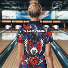 Load image into Gallery viewer, Back view of a woman in a bowling alley wearing a custom team jersey with red, blue, white, and black splatter graphics, â€œTEAM NAMEâ€ text, and a large eagle clutching a red bowling ball.