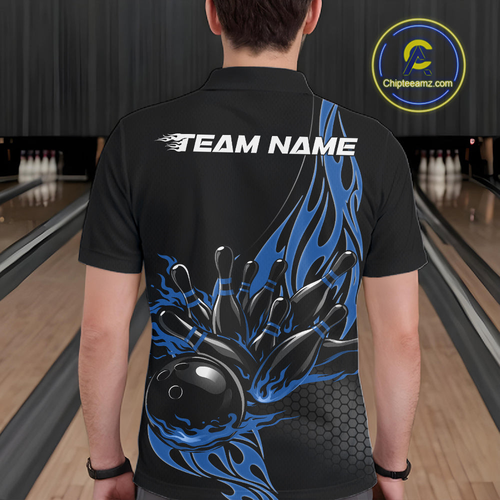 Male model seen from the back in a bowling lane wearing a black polo shirt featuring a blue flaming black bowling ball striking pins in a dynamic motion design.