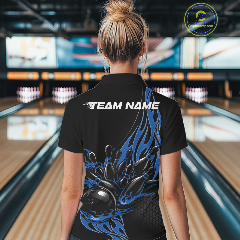 Back view female model at bowling lane wearing black quarter zip shirt featuring blue flaming bowling strike graphics