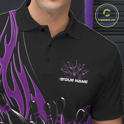 Close-up view of the left chest area of a black bowling polo shirt showing a purple flaming black bowling ball and pins design detail.