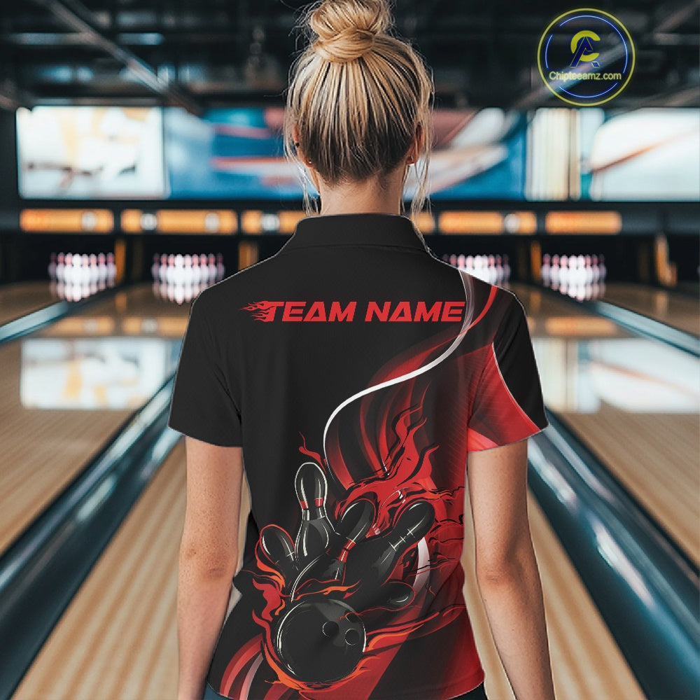 Female model back view at bowling lane wearing black and red polo shirt showcasing flame bowling ball striking pins in bold dynamic artwork.
