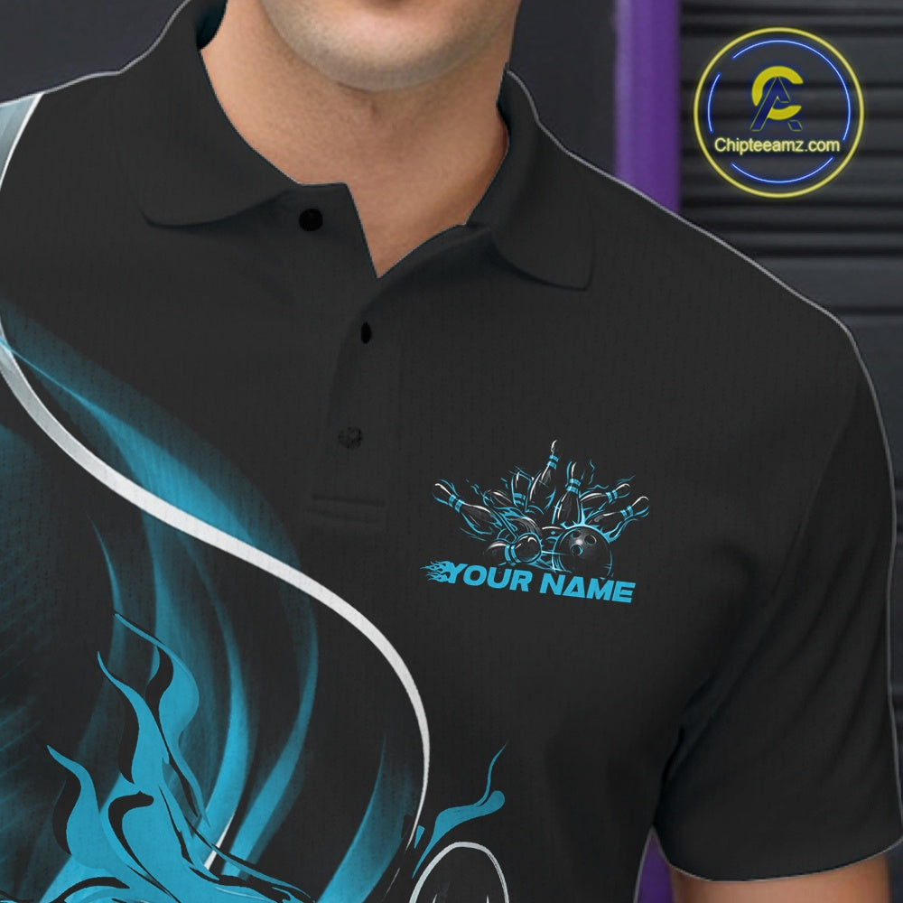 Close-up view of the left chest area of a black and blue bowling polo shirt showing a flame bowling ball and pins design detail.