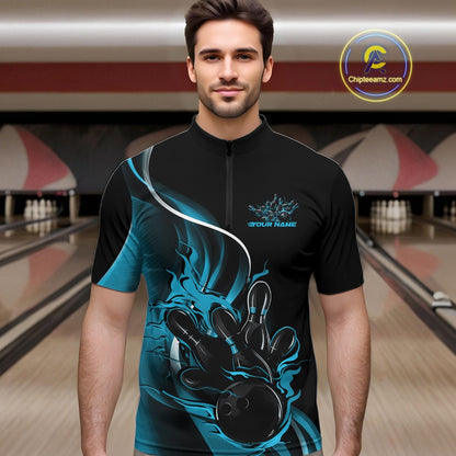 Male model front view in bowling alley wearing black and blue quarter zip shirt with flame bowling ball hitting pins illustration