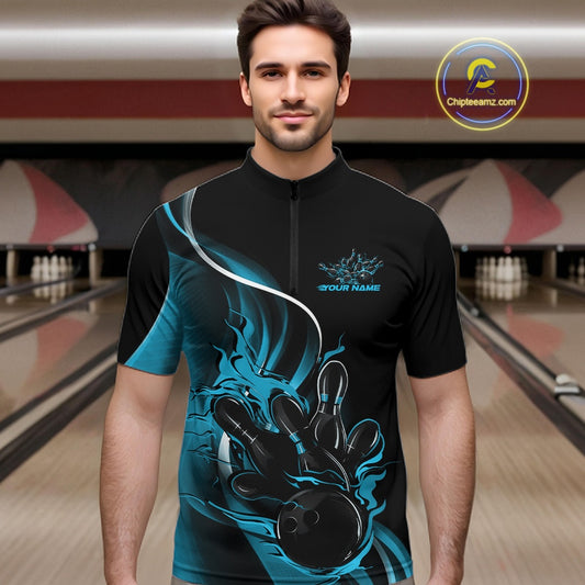 Male model front view in bowling alley wearing black and blue quarter zip shirt with flame bowling ball hitting pins illustration
