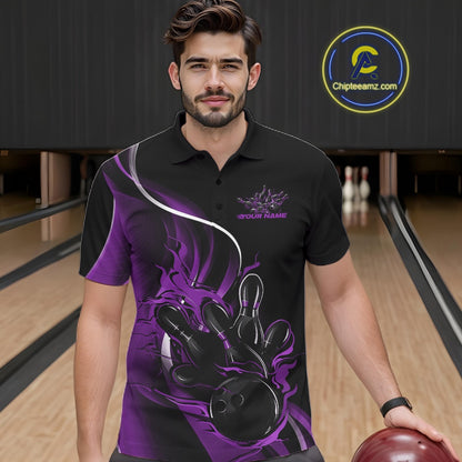 Male model seen from the front in a bowling lane wearing a black and purple polo shirt featuring a flame bowling ball striking pins in a dynamic sports scene.
