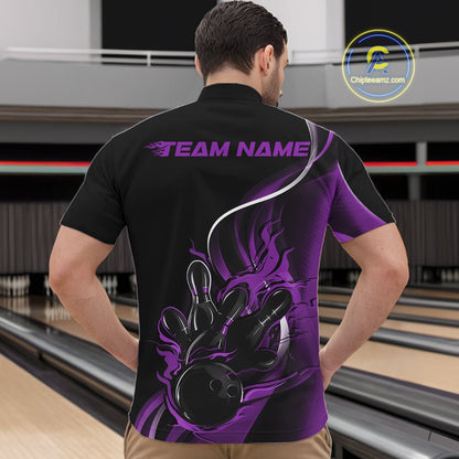 Male model front view in bowling alley wearing black and purple quarter zip shirt with flaming bowling ball knocking down pins graphics