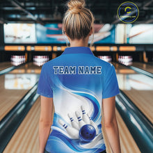 Load image into Gallery viewer, Female model standing in a bowling lane showing the back of a white and blue bowling polo shirt with abstract wave lines and a glossy bowling ball striking pins graphic.
