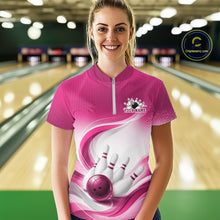 Load image into Gallery viewer, Female model at the bowling lane wearing a white and pink bowling quarter-zip shirt showcasing sweeping wave accents and a bowling action scene