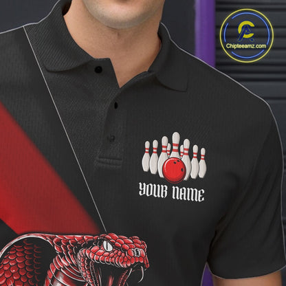 Close-up left chest graphic on a black bowling polo featuring a red cobra and bowling ball motif.