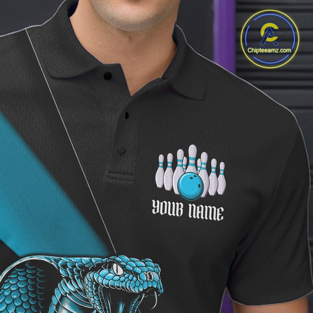 Left chest close-up of a black bowling polo featuring a blue cobra, bowling ball, and pin artwork.