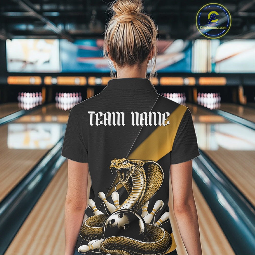Back view of a black womens bowling polo showcasing a yellow cobra wrapped around a bowling ball with scattered pins.