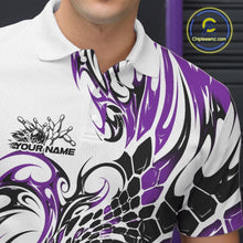 Load image into Gallery viewer, Close-up of the left chest area on a white bowling polo shirt with purple and black tribal graphics and a glossy red bowling strike design