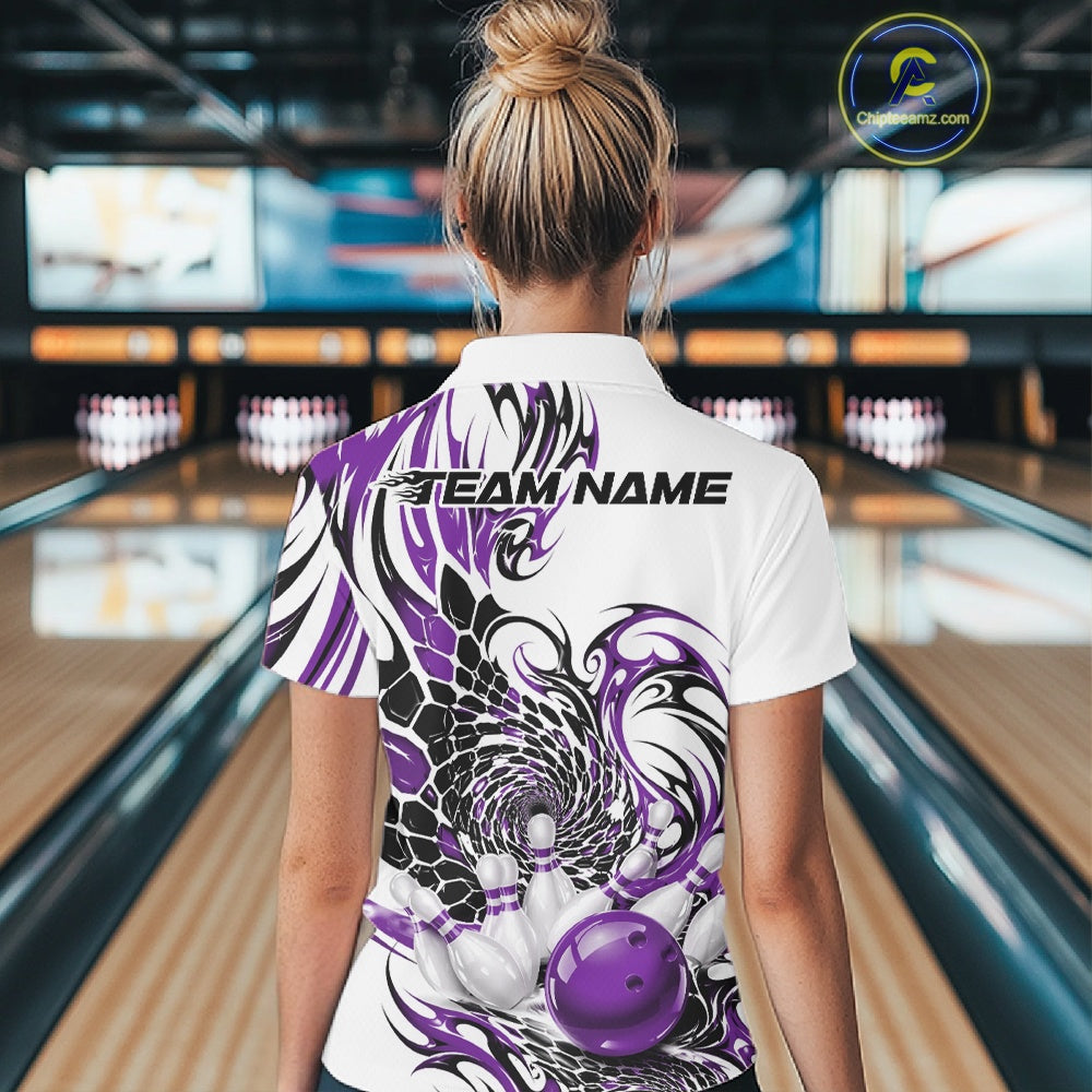 Back view of a female model wearing a white bowling polo shirt with purple and black tribal artwork, scale-inspired textures, and a glossy red bowling ball striking pins