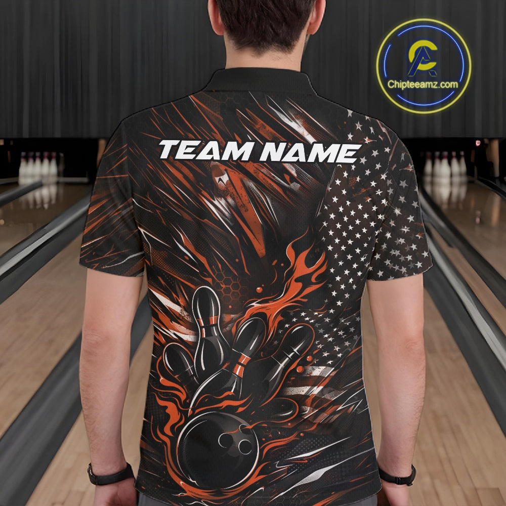Back view of a male model in a bowling venue wearing a black and orange polo shirt featuring a patriotic bowling strike motif.