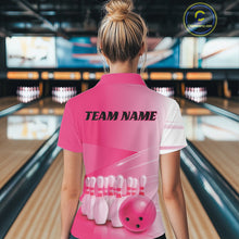 Load image into Gallery viewer, Back view female model at the bowling lane wearing a quarter zip shirt with bowling ball and pins arranged across a pink gradient layout.