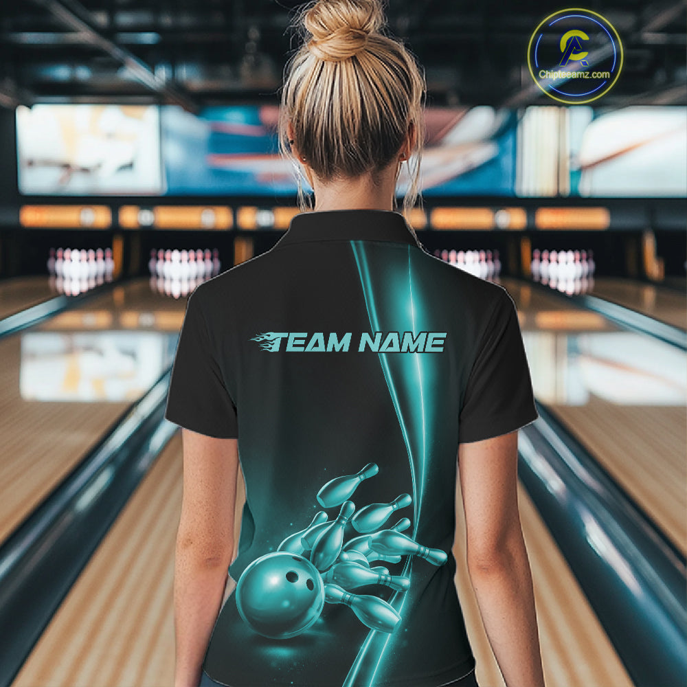 Back view of a female model in a bowling lane wearing a black polo shirt featuring turquoise blue bowling ball and pins artwork with athletic sports styling.