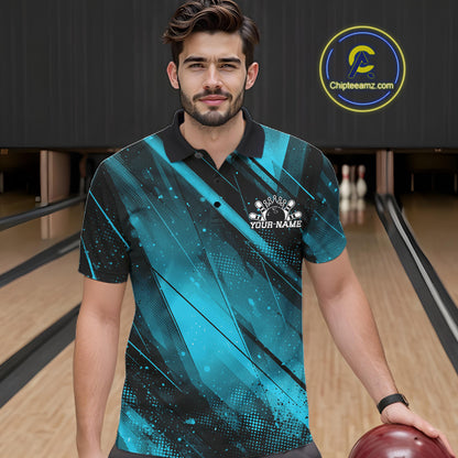 Man wearing a blue and black bowling shirt with a logo in a bowling alley.