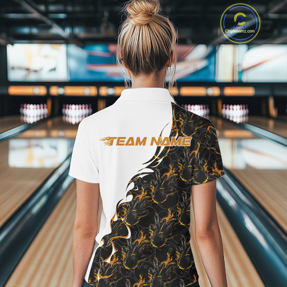 Back view of a female model in a bowling lane wearing a white quarter-zip shirt, featuring yellow and black flame bowling pattern with bold athletic bowling graphics.