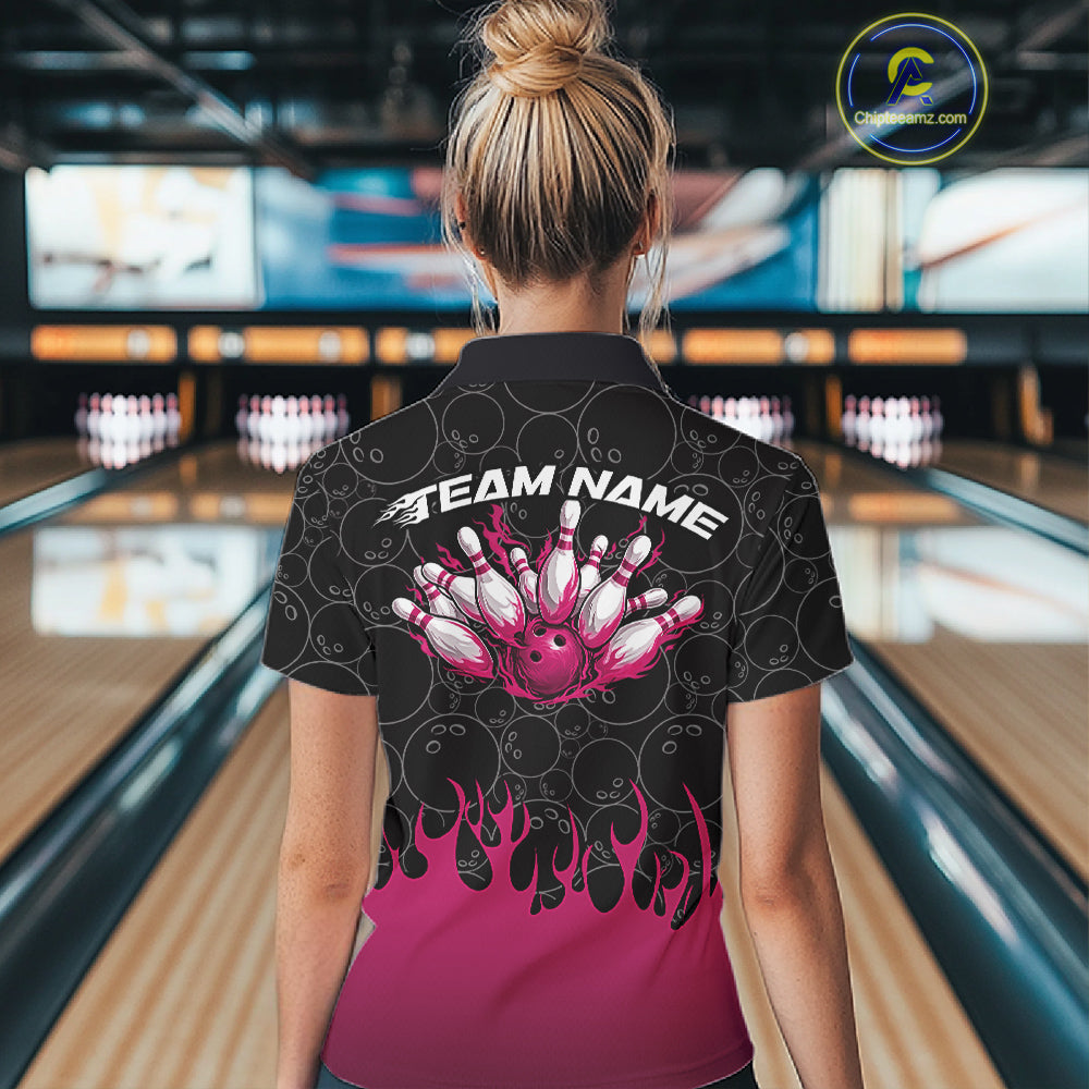 Inside a bowling lane, back view of a female model wearing a black quarter-zip shirt, featuring vibrant pink flames and bowling ball pattern design with energetic bowling visuals.