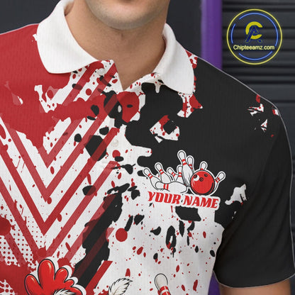 A close-up of a person wearing a short-sleeve polo shirt with a bold red, black, and white abstract splatter design. The shirt features a white collar, a bowling pin and ball graphic on the chest, and the text 'YOUR NAME' in red.