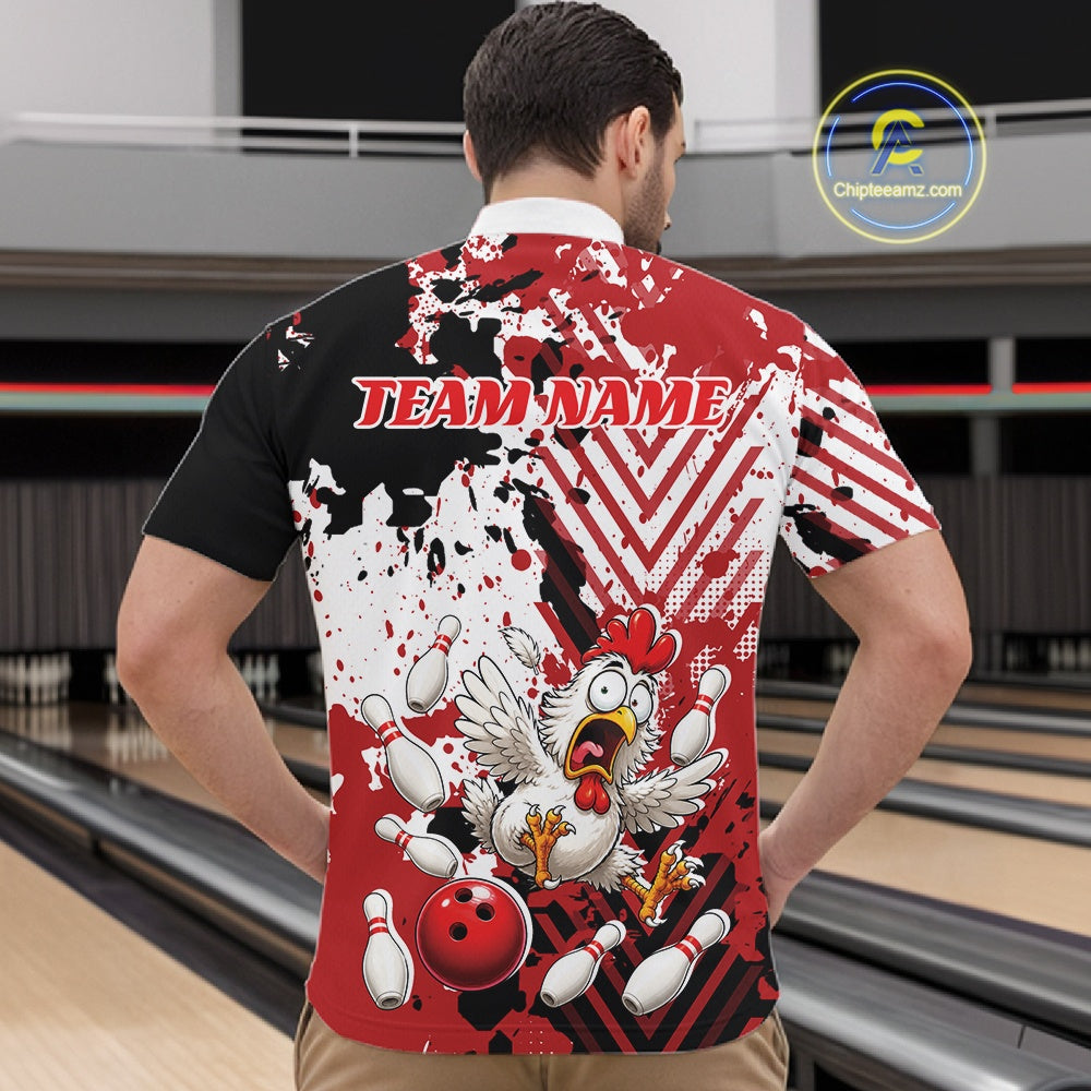 A man viewed from behind wearing a short-sleeve bowling jersey with a red, white, and black splatter design, a cartoon chicken breaking bowling pins, a red bowling ball, and the text 'TEAM NAME' across the upper back. Bowling lanes are visible in the background.
