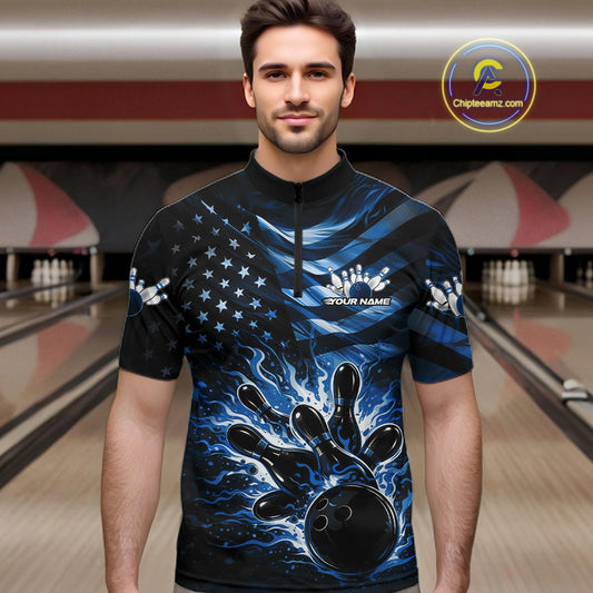 Male model wearing a black bowling quarter-zip shirt at the lane with blue flame bowling artwork and flag-inspired elements.
