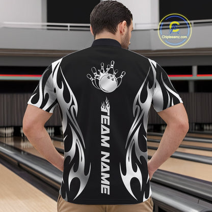 Bowling center scene with male model wearing black quarter zip shirt featuring silver tribal flame bowling ball striking pins in energetic motion design.