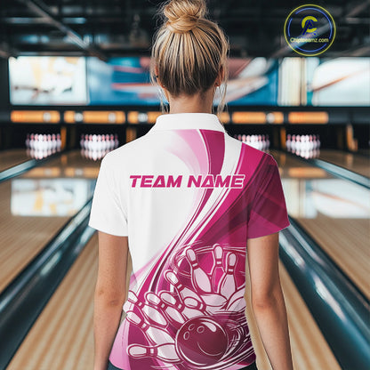 Back view of a women s white and pink bowling quarter zip showcasing sweeping curve accents and a bowling ball crashing into pins graphic inside a bowling alley.