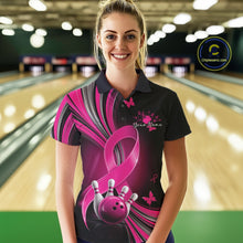 Load image into Gallery viewer, Front view of a female model in a black and pink bowling polo with breast cancer awareness ribbons, small butterflies, and bowling graphics