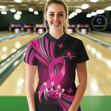 Load image into Gallery viewer, Female model wearing a black and pink bowling quarter zip with pink ribbons, small butterflies, and bowling artwork, front view
