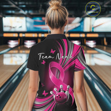 Load image into Gallery viewer, Female model in a black and pink bowling quarter zip with breast cancer awareness ribbons, small butterflies, and bowling artwork, back view
