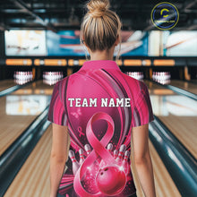 Load image into Gallery viewer, Back view of a female model wearing a pink and black bowling polo with breast cancer awareness ribbon artwork and bowling graphics