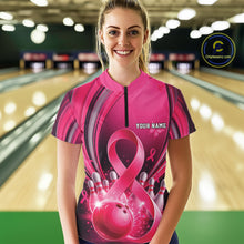 Load image into Gallery viewer, Front view of a female model wearing a pink and black bowling quarter zip featuring breast cancer awareness ribbons and bowling graphics