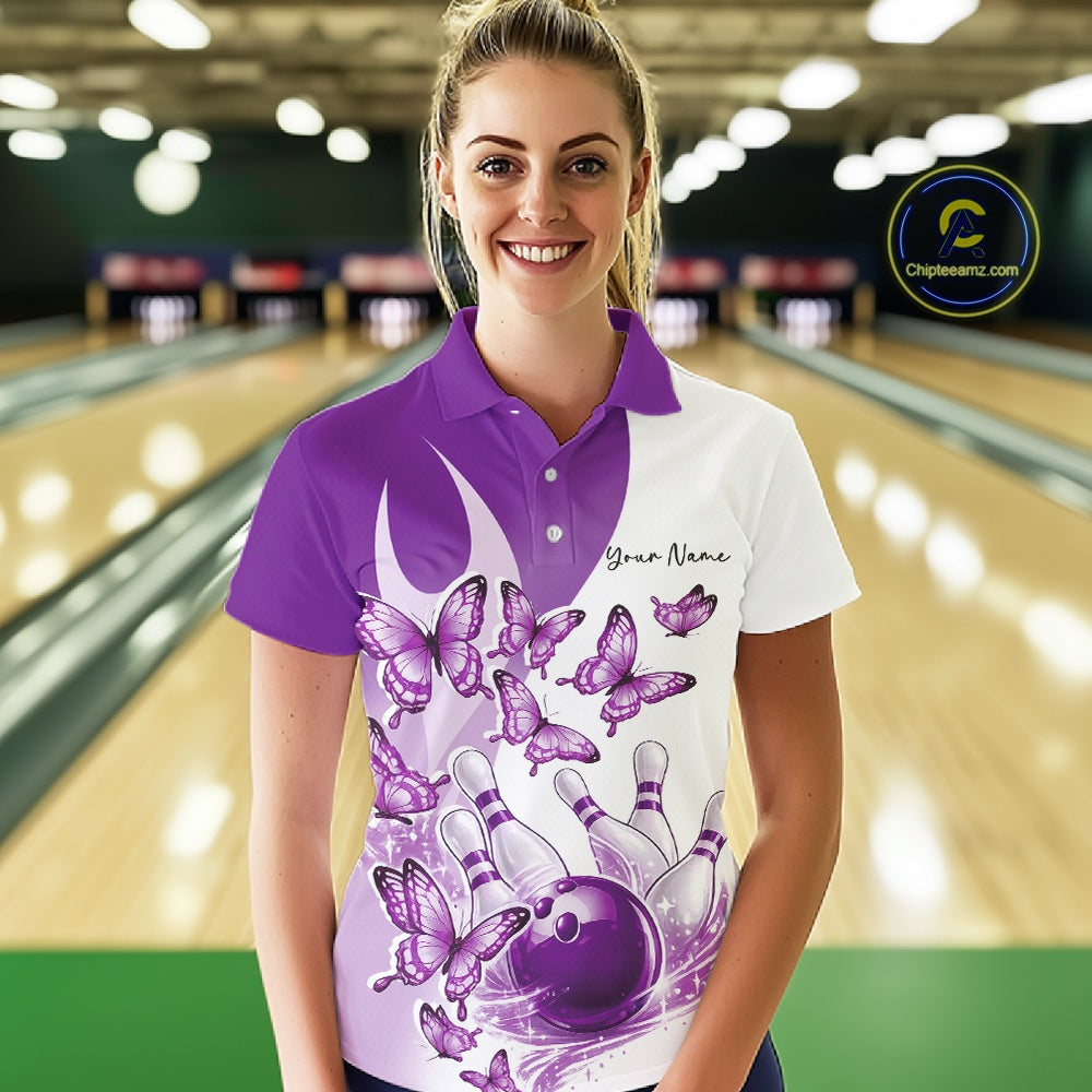 Front view of a female model in a white and purple bowling polo with butterfly artwork and bowling graphics