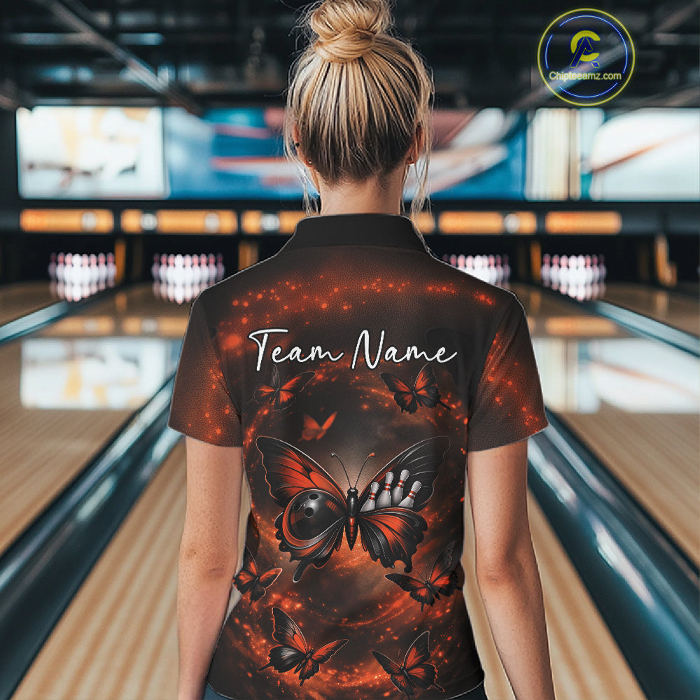 Back view of a female model at a bowling lane wearing a polo shirt featuring an orange and black butterfly with smoky bowling-themed graphics.