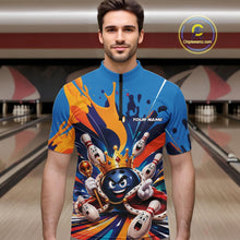 Load image into Gallery viewer, Front view of a male model wearing a bowling quarter zip shirt featuring a crowned cartoon bowling ball holding a royal scepter with cheering animated bowling pins and colorful paint splashes in a bowling lane.
