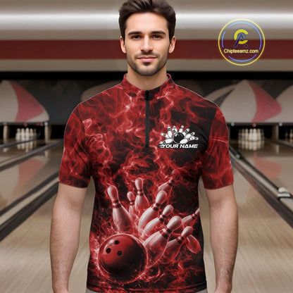 Male model at the bowling lane wearing a quarter-zip with red bowling ball strike artwork and flame accents.