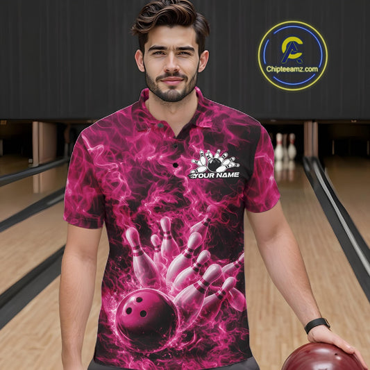 Male model wearing a bowling polo in a bowling alley with pink bowling ball strike artwork and fiery graphics.