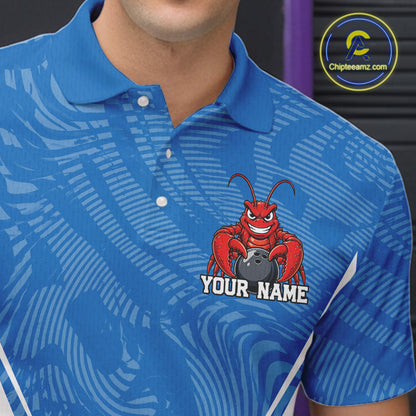 Close-up front view of the left chest area on a blue custom bowling polo shirt featuring a funny aggressive crawfish holding a bowling ball in a sportswear-style design.