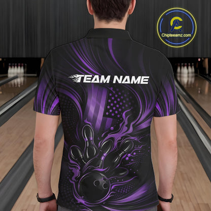 Back view of a male model in a bowling alley wearing a black and purple polo featuring patriotic bowling action artwork.