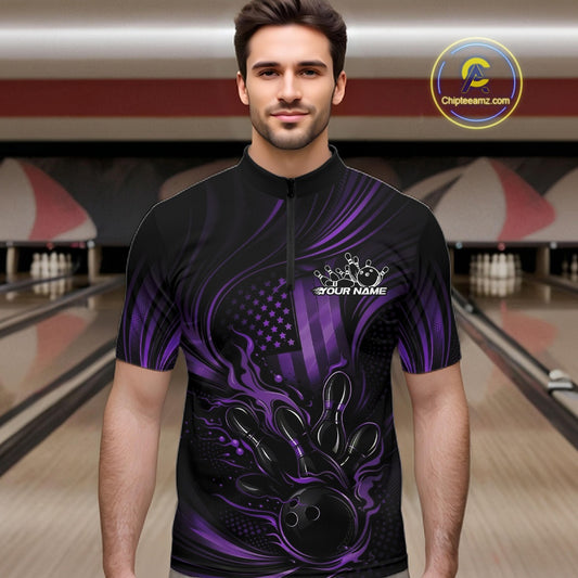 Male model in a bowling alley wearing a black and purple bowling quarter-zip shirt featuring patriotic bowling-themed graphics and flame effects.